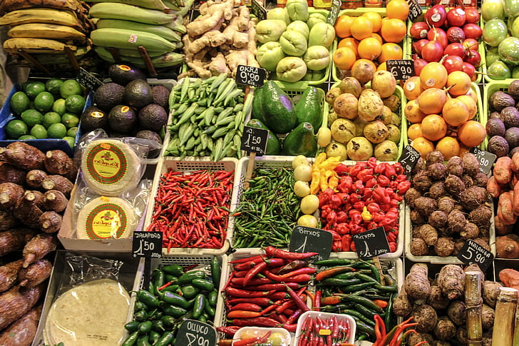 assorted fruits and vegetables in plastic baskets