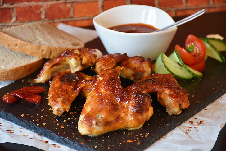 grilled chicken with sauce and bread dish