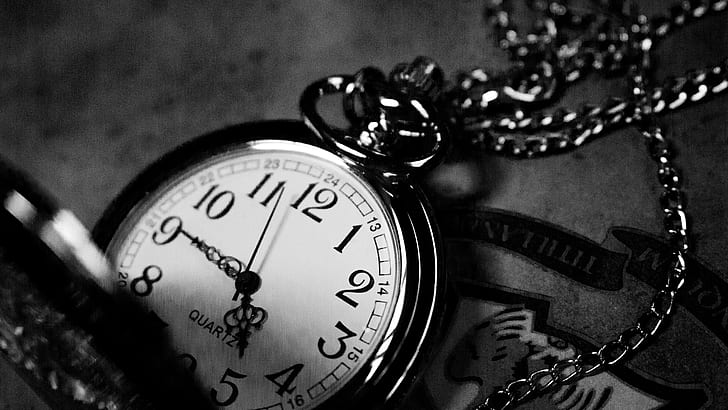 grayscale photo of silver-colored pocketwatch