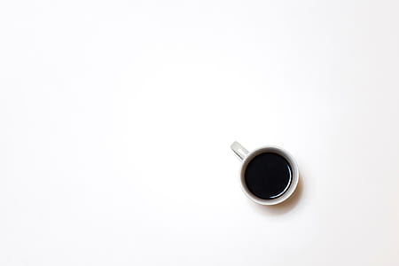 photo of white mug on white surface