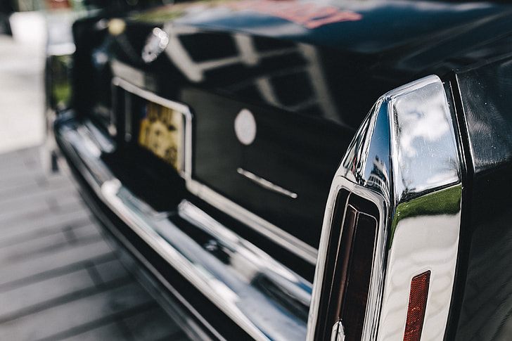 Close up of antique black and chrome Cadillac car