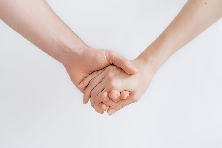 Royalty-Free photo: Two hands holding each other | PickPik