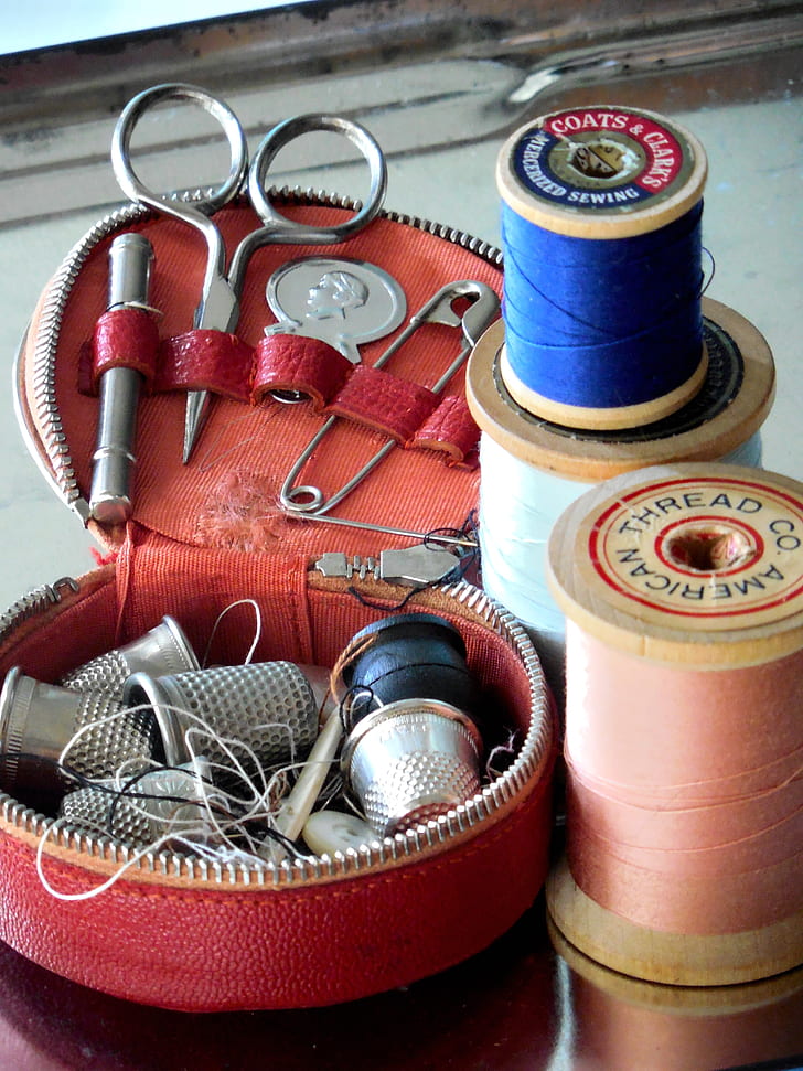 closeup photography of sewing kits