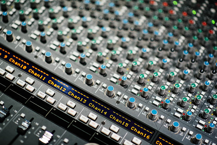 shallow focus photo of gray and blue audio mixer