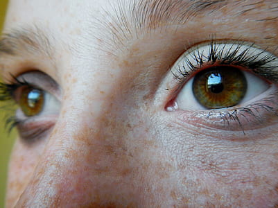 closeup photo of human eyes