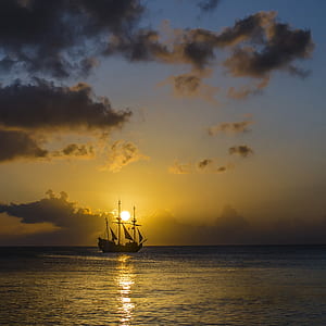 silhouette of galleon ship at sunset