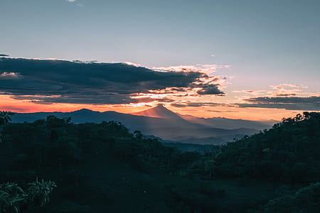 silhouette of mountain under sunset