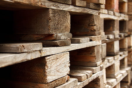closeup photo of brown wood pallets
