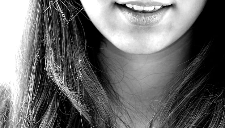 grayscale photography of woman sticking her mouth open