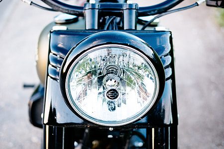 round motorcycle headlight in macro shot