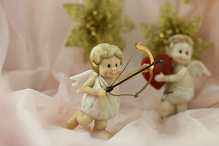 angel with bow ceramic figurine