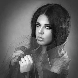 grayscale photo of woman with sheer veil