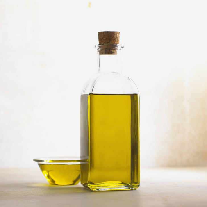 bottle and cup of olive oil