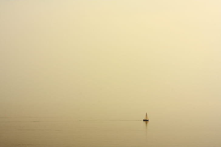 white sailboat on water at daytime