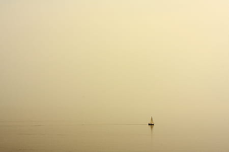 white sailboat on water at daytime