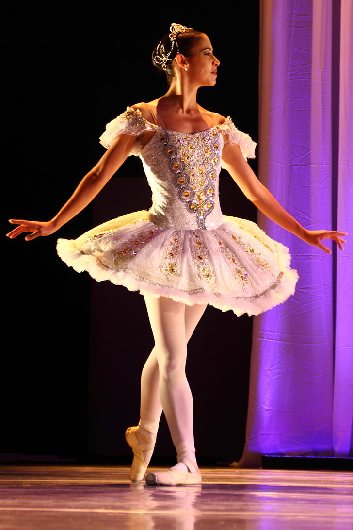 close up photo of woman wearing white ballerina dress
