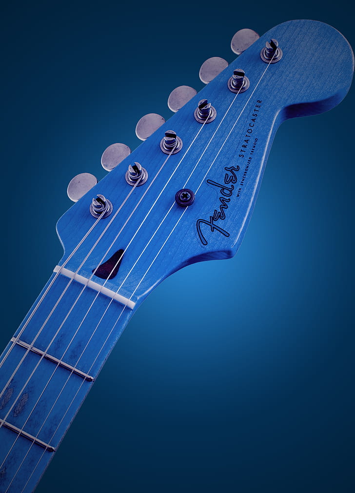 blue Fender Stratocaster electric guitar headstock