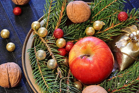 photo of apple fruit surrounded by baubles