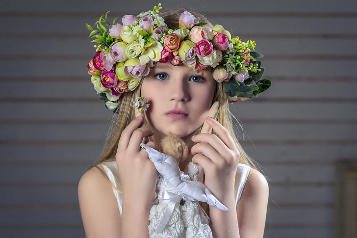 woman in green and pink petaled flower headdress