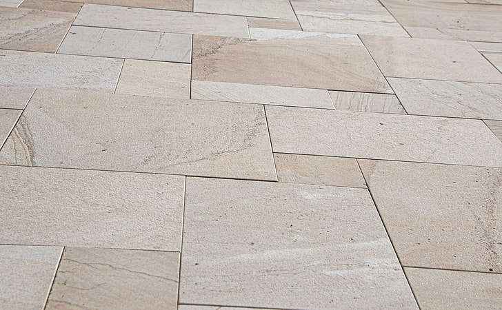 close-up photo of beige ceramic tiled floor