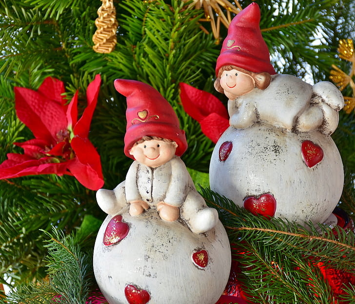 two Christmas elves ceramic baubles placed on Christmas tree