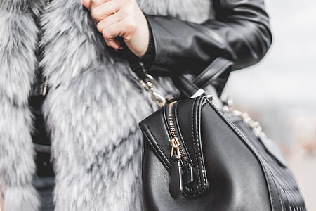 Woman Holding Her Black Leather Bag Close Up