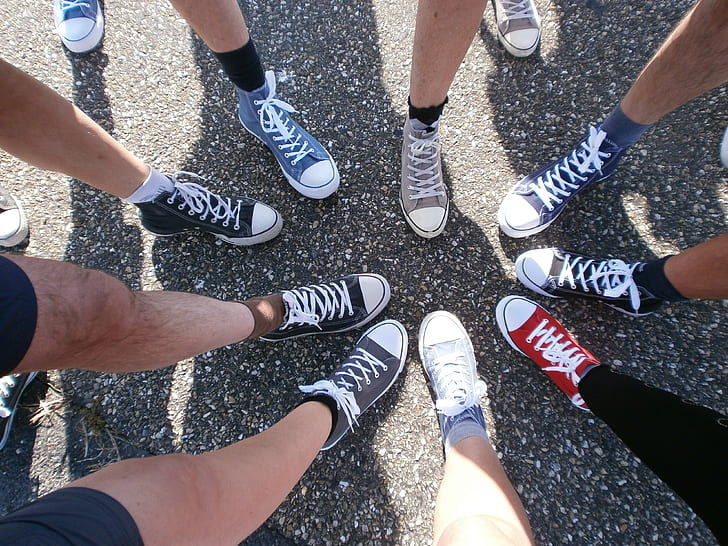 persons showing sneakers