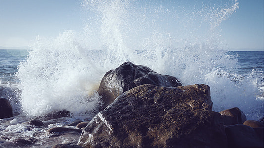 wave crashing on stone
