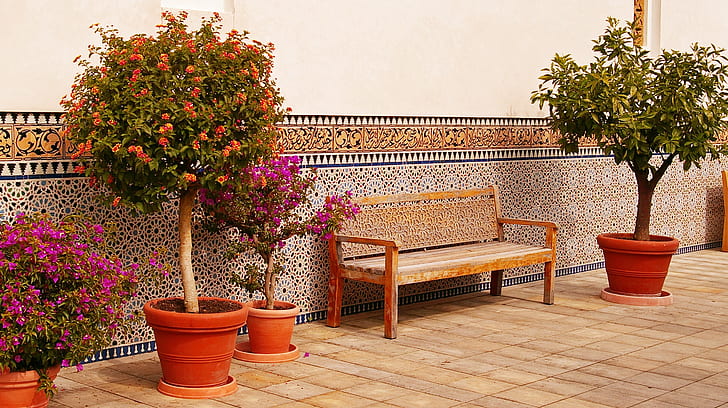 brown wooden bench in front of brown painted wall