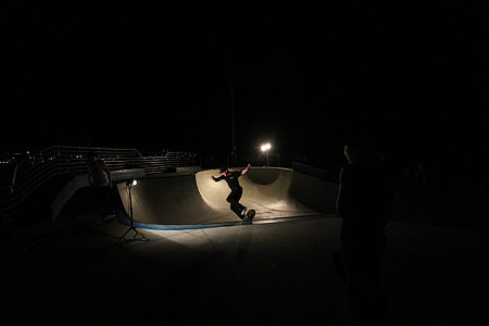 person skating on a halfpipe