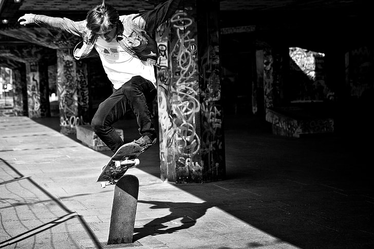 Action shot of a skater doing a jump on the Southbank in London, England