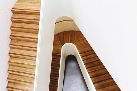 A modern wooden staircase captured in a building in London