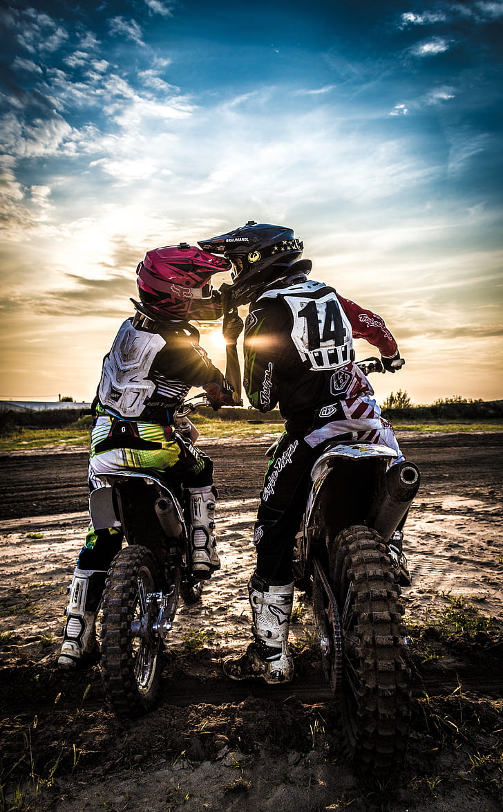 two person wearing motocross bike gear set