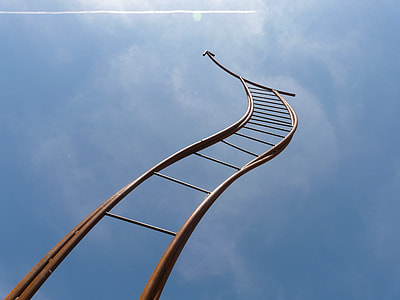 low angle view of brown ladder under blue sky