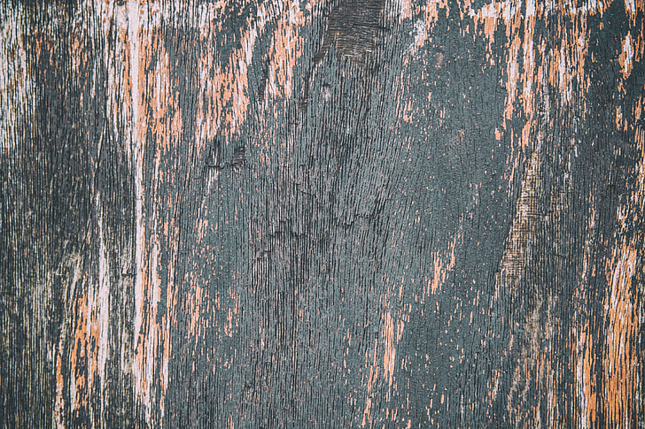Close-up shot of fading wood and paint texture, image captured with a Canon DSLR