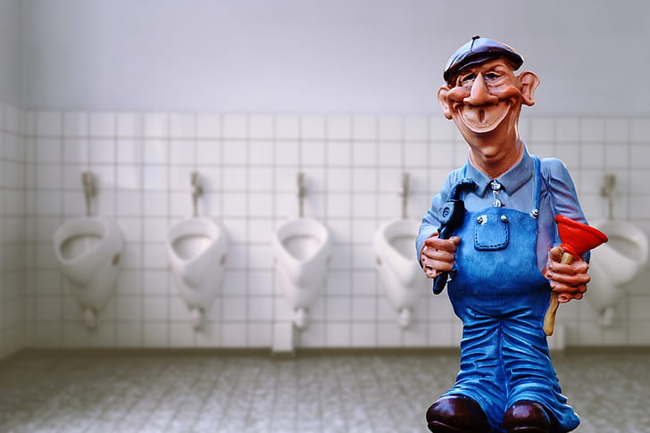 man in blue jumper standing near inside rest room