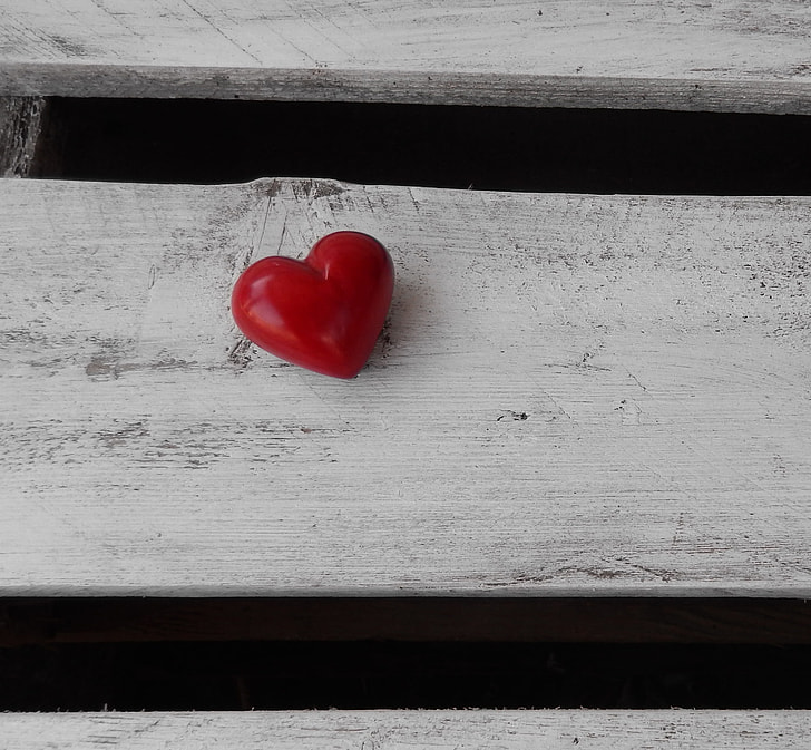 red heart decor on white wooden board