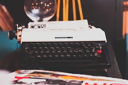 close up photo of white and black typewriter