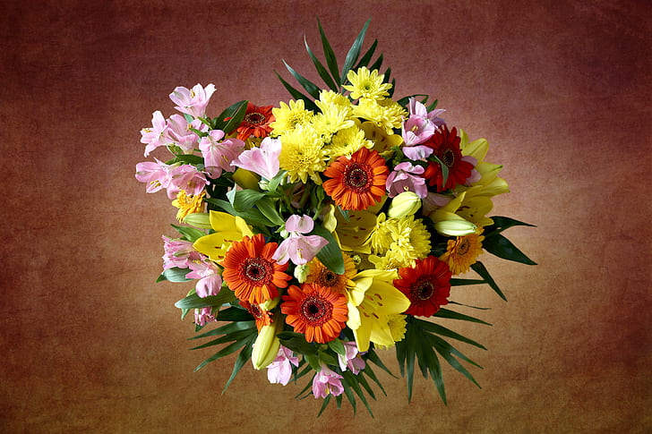 close-up photograph of yellow and orange petaled flower arrangement