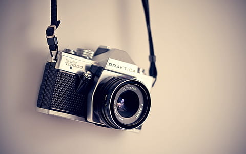 black and Praktica DSLR camera