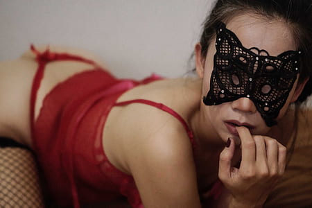 woman in red nighties wearing mask