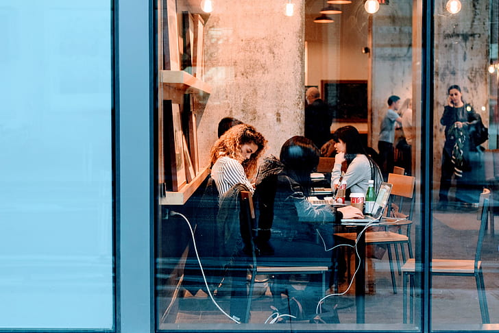 women sitting inside a restaurant