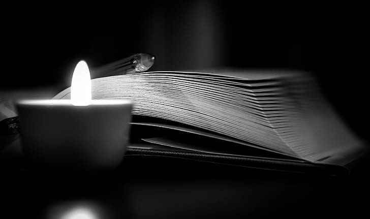 open book near candle