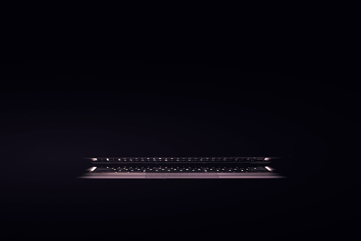 Laptop computer sitting in a dark room