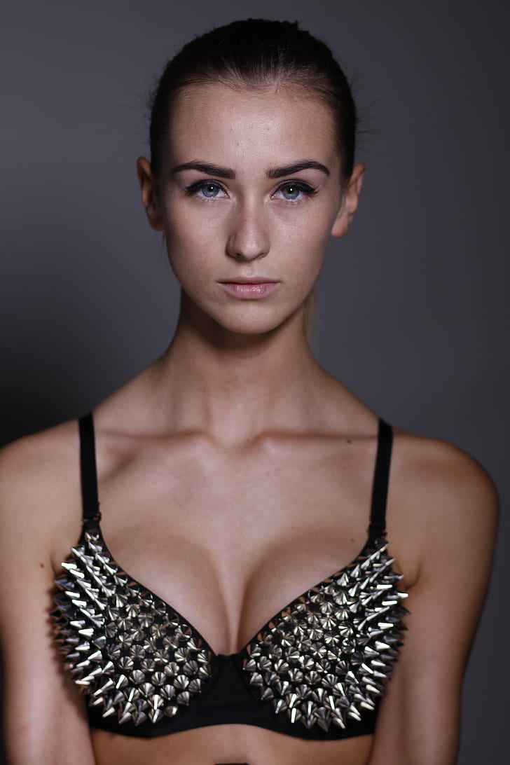 Royalty-Free photo: Woman wearing grey spiky black push-up bra