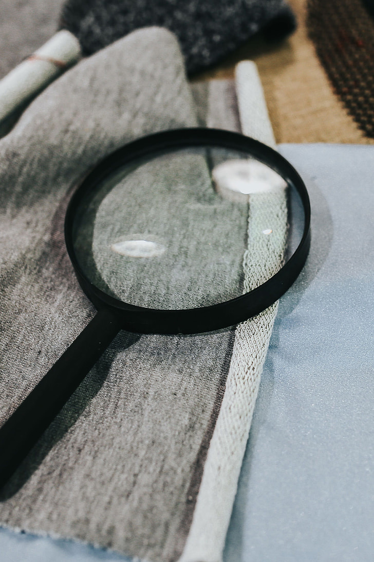Magnifying glass with fabric on a table