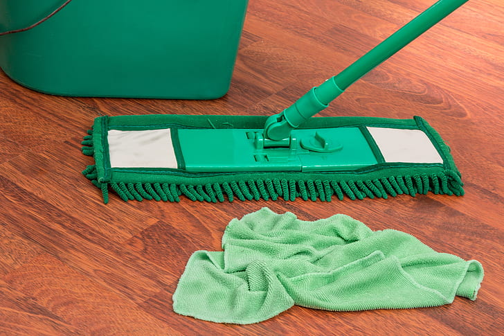 green mop, pail, and towel