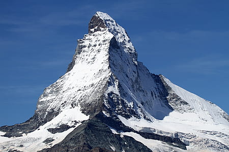 photograph of mountain coated by snow ice