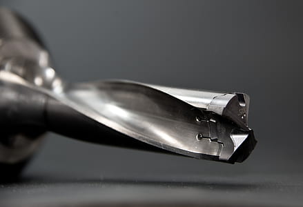 closeup photography of grey metal tool
