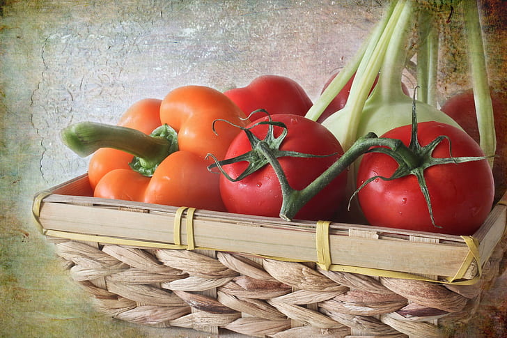 tomatoes on brown wicker basket